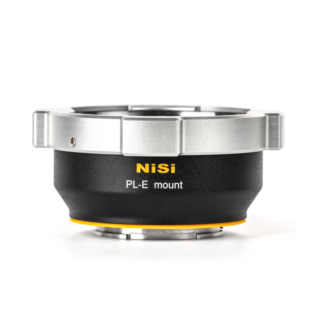 NiSi PL-E mount adapter shown from front angle, displaying silver top ring, black body with yellow accent ring, and product branding.