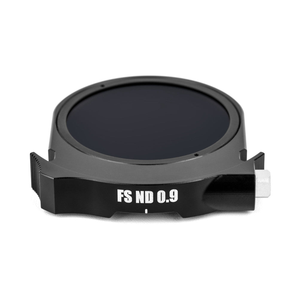Angled front view of a circular gray and black ND filter with "FS ND 0.9" labeling and mounting tabs visible against a white background.