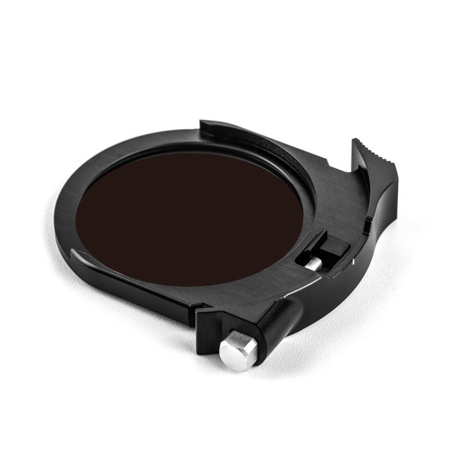 Black circular ND filter with dark lens glass shown at an angle, displaying the filter housing and mounting mechanism with adjustment knob.