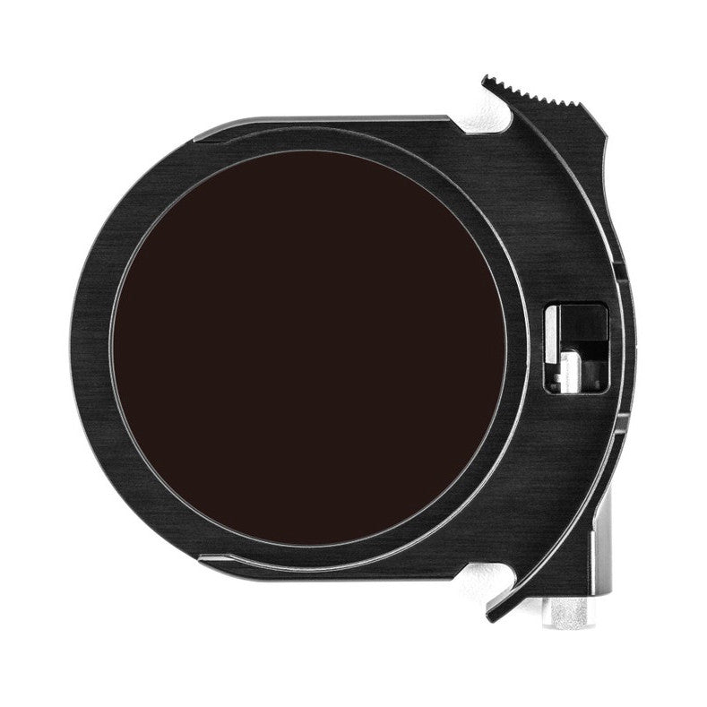 Top-down view of a black square filter holder with circular dark glass lens element and mounting bracket hardware visible.