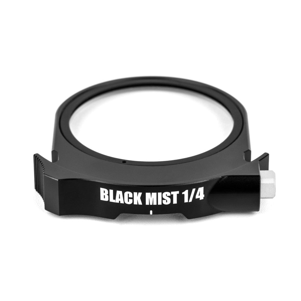 Black circular filter ring labeled "BLACK MIST 1/4" shown at a slight angle against a white background, displaying the drop-in filter frame design with adjustment knob.