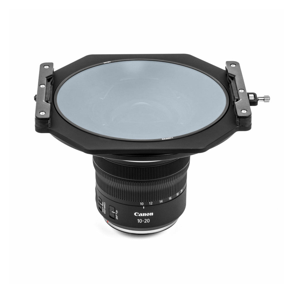 Top-down view of NiSi S6 filter holder mounted on Canon RF 10-20mm lens, showing square filter frame with blue-tinted glass and adjustment mechanisms.
