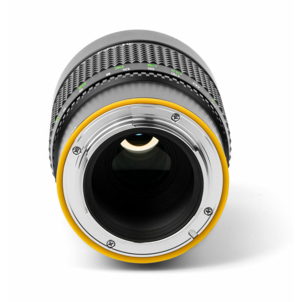 Rear view of NiSi 250mm f/5.6 reflex lens showing yellow mount ring, focus scale markings, and black interior barrel against white background.
