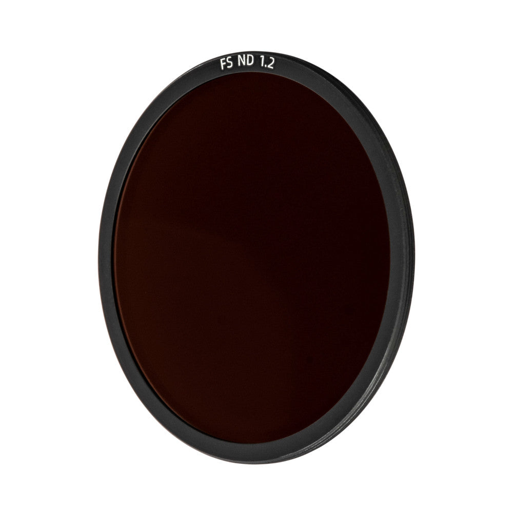 Front view of a circular dark neutral density camera filter with black rim and text "FS ND 1.2" printed on the edge.