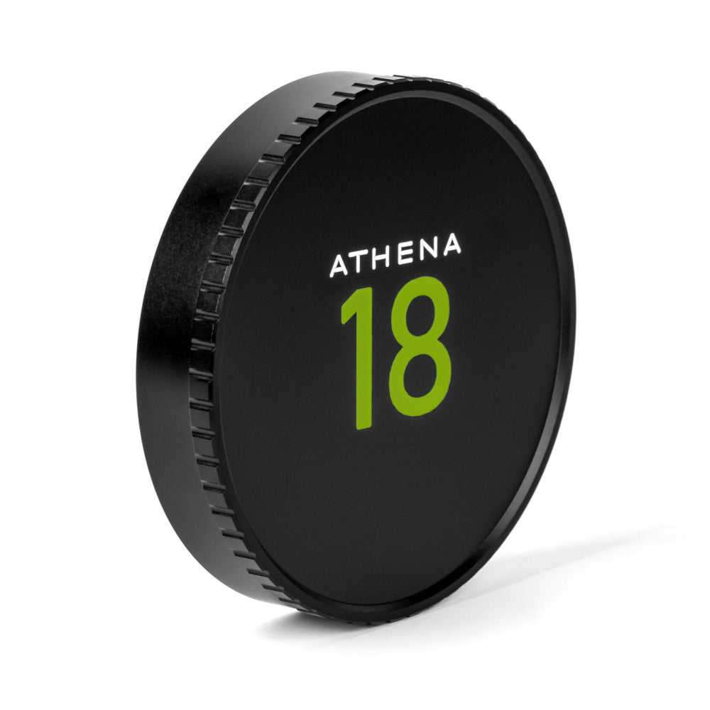 Black circular lens cap with "ATHENA 18" in white and green text, shown at an angled view displaying the ridged edge and threaded grip pattern.