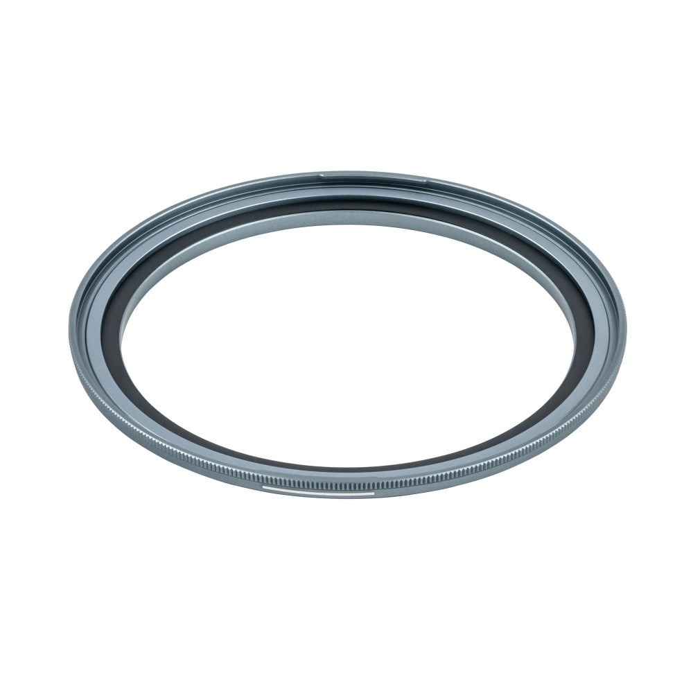 Overhead angled view of a gray metal magnetic adapter ring with textured inner edge against white background.