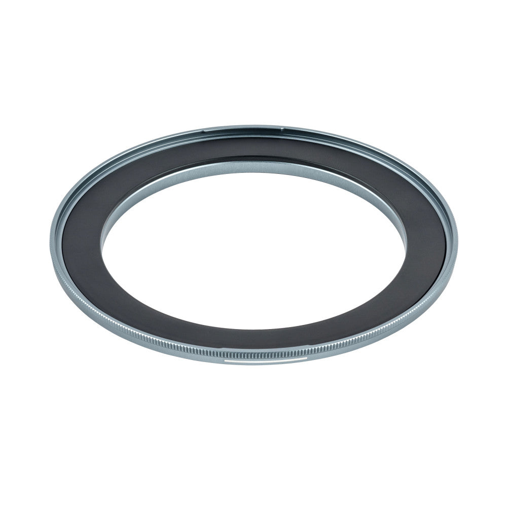 Overhead view of a metallic magnetic adapter ring with a dark inner band and ribbed outer edge, shown against white background.