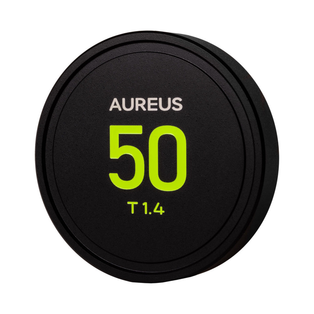 Front view of a black circular lens cap with "AUREUS 50 T1.4" printed in white and neon yellow text.
