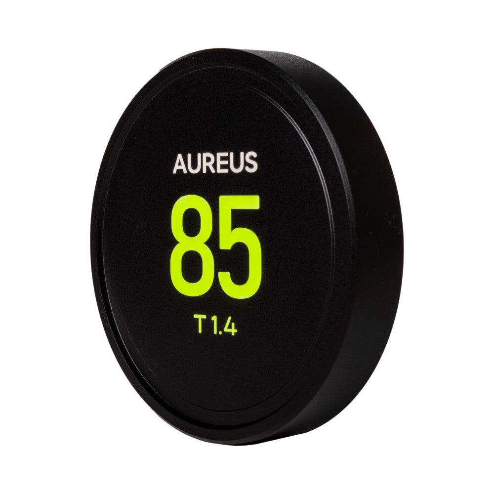 Black circular lens cap with "AUREUS 85 T1.4" text in white and bright yellow, shown at an angled front view against white background.