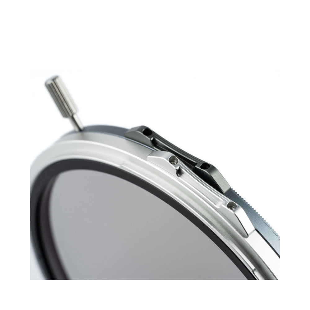Close-up side view of a silver magnetic filter holder showing the metal frame, crown cap, and attachment mechanism against a white background.