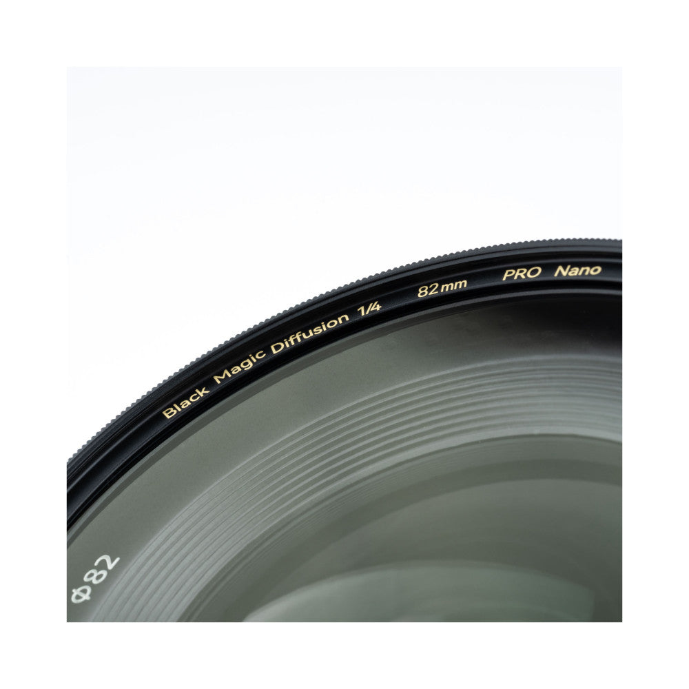 Close-up detail of 82mm circular filter showing engraved text on black rim against white background.