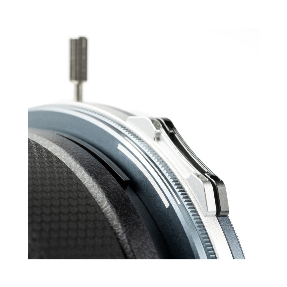 Close-up side view of magnetic filter ring and adapter showing metal construction and attachment mechanism against white background.