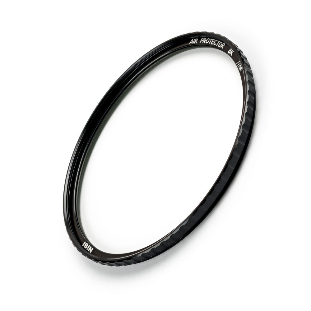 Black circular camera filter ring displayed at an angle against white background, showing engraved text and textured edge grip.