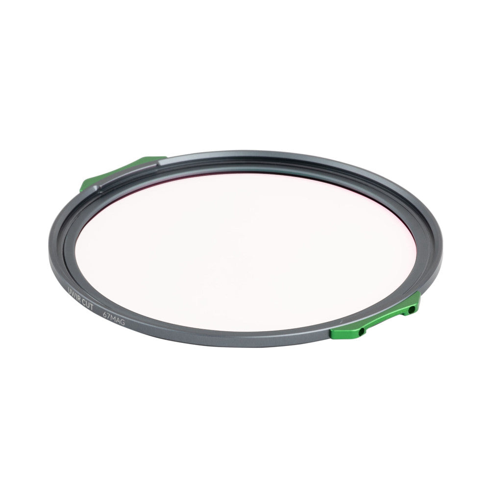 Angled view of a circular gray magnetic filter ring with green mounting tabs visible on the sides, displaying the NiSi branding and 67MAG size marking.
