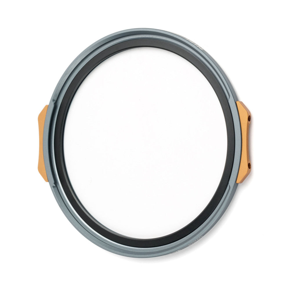 Circular magnetic filter ring with gray outer body and orange side tabs, photographed from the front against a white background.