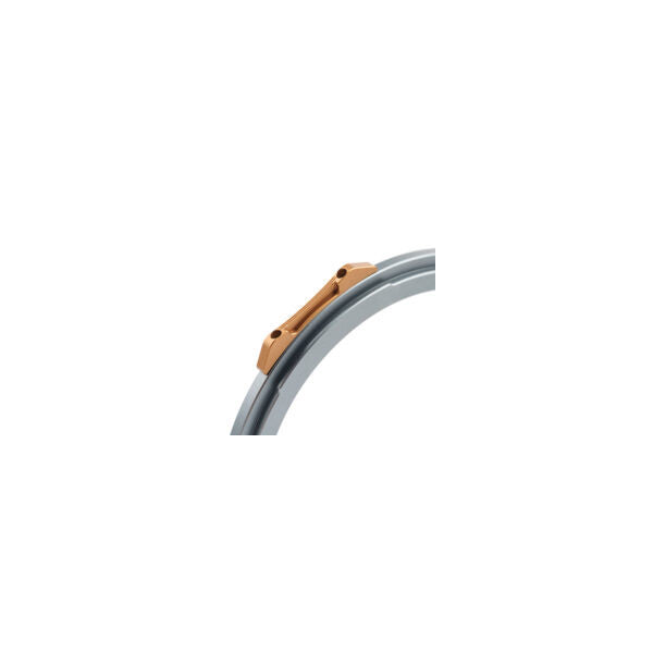 Close-up side view of a curved gray filter ring with a copper-colored magnetic mounting bracket against a white background.