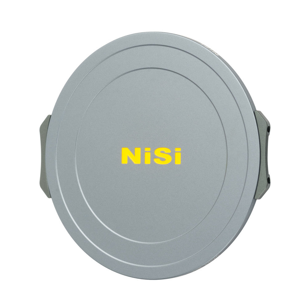 Gray circular magnetic lens cap with "NiSi" branding in yellow text, shown from front view with side grip tabs visible.