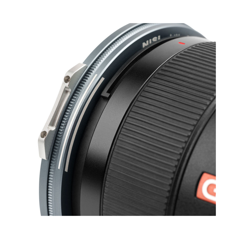 Close-up side view of NiSi magnetic adapter ring showing metallic mounting bracket, black textured barrel, and red accent detail on lens.