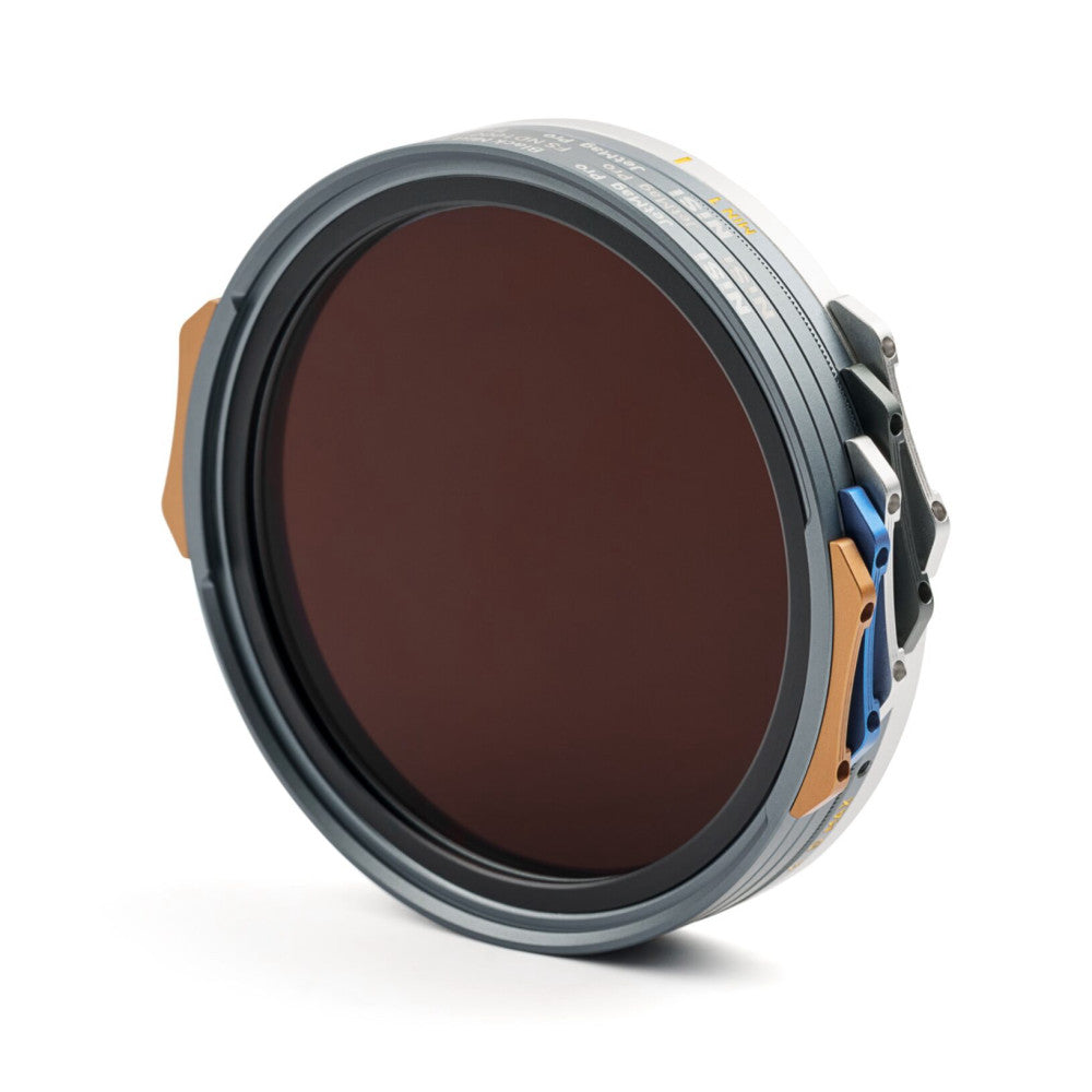 Angled side view of a round magnetic filter with dark reddish-brown glass and orange and blue metal mounting brackets against a white background.