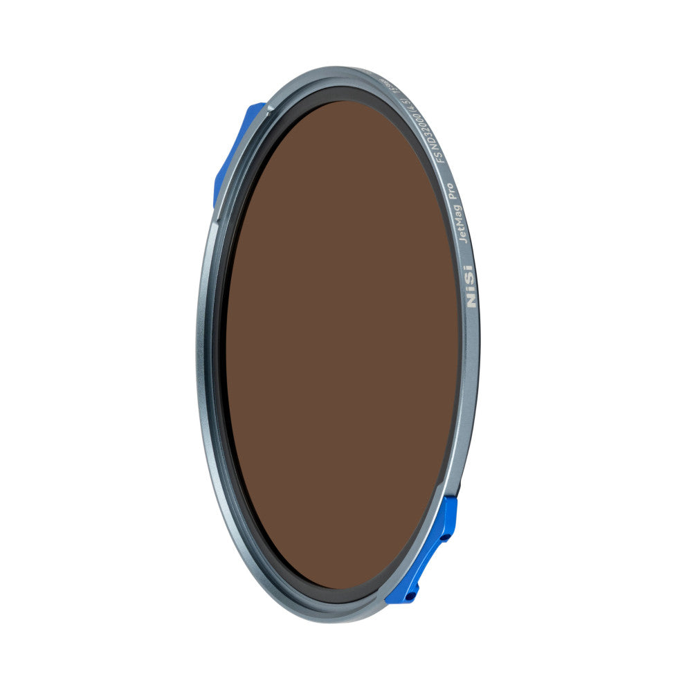 NiSi JetMag Pro ND32000 filter shown at an angle, displaying the dark brown glass element and gray ring with blue magnetic quick-release lever.
