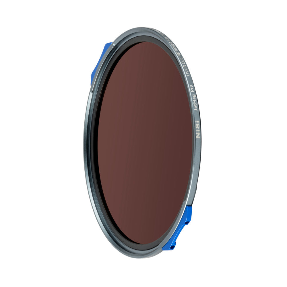 Circular gray and blue magnetic ND filter with dark reddish-brown tinted glass, shown tilted at an angle against white background.
