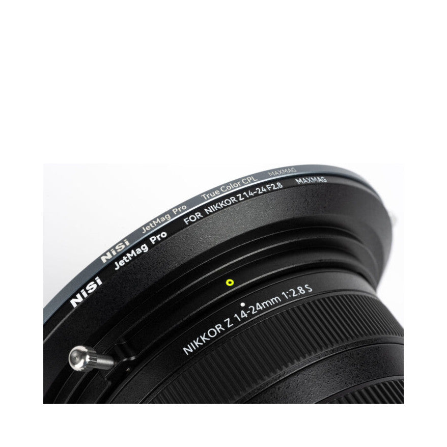 Close-up angled view of NiSi JetMag Pro CPL filter mounted on Nikkor Z 14-24mm lens, showing filter ring and lens barrel details.