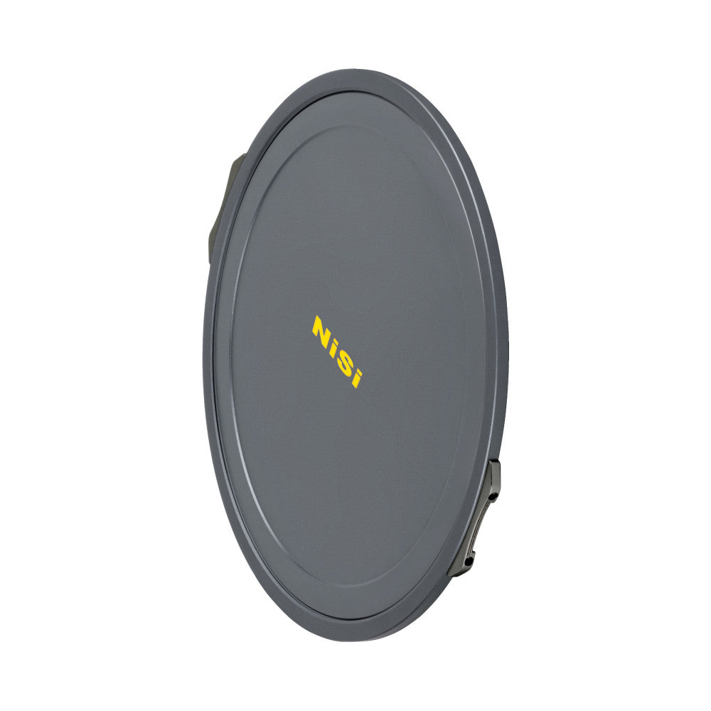 Gray circular magnetic lens cap with NiSi branding in yellow text, shown at an angled side view against white background.