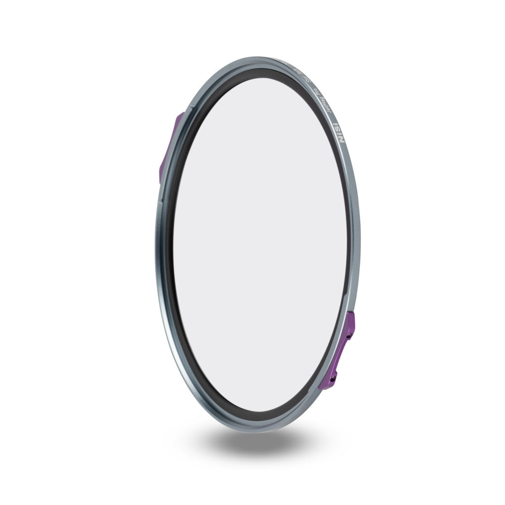 Angled side view of a circular gray magnetic filter with purple quick-release clips visible on the right edge, displaying the clear glass center and dark inner rim.