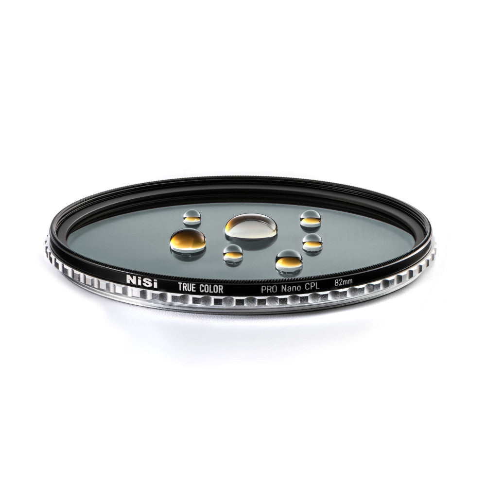 NiSi 82mm Pro Nano CPL filter shown at an angle displaying water droplets on the glass surface, demonstrating its hydrophobic coating properties.
