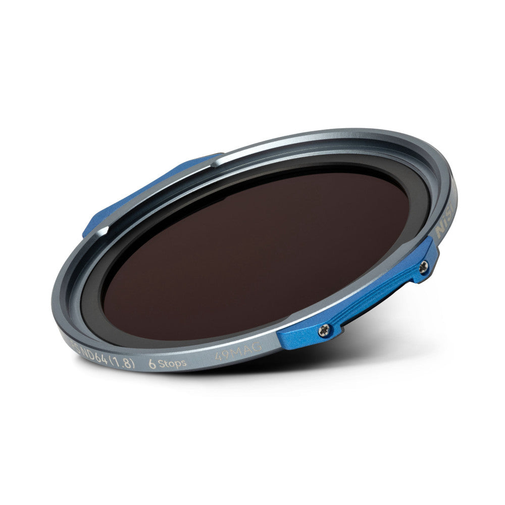 Angled view of a round magnetic ND filter with dark tinted glass, gray metal ring, and blue metal clips against a white background.