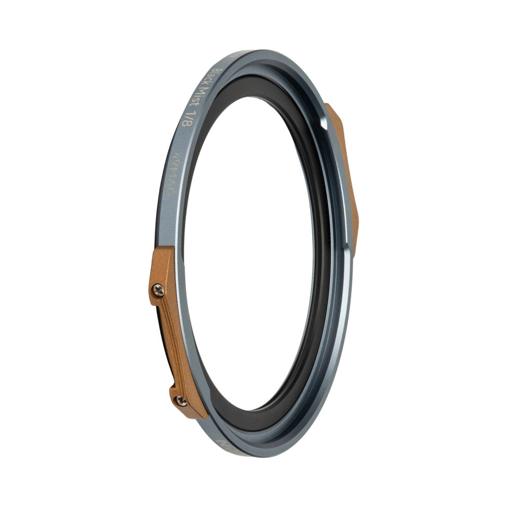Circular magnetic filter ring shown at an angle, displaying gray metal frame with brown leather attachment strap and black inner filter component.