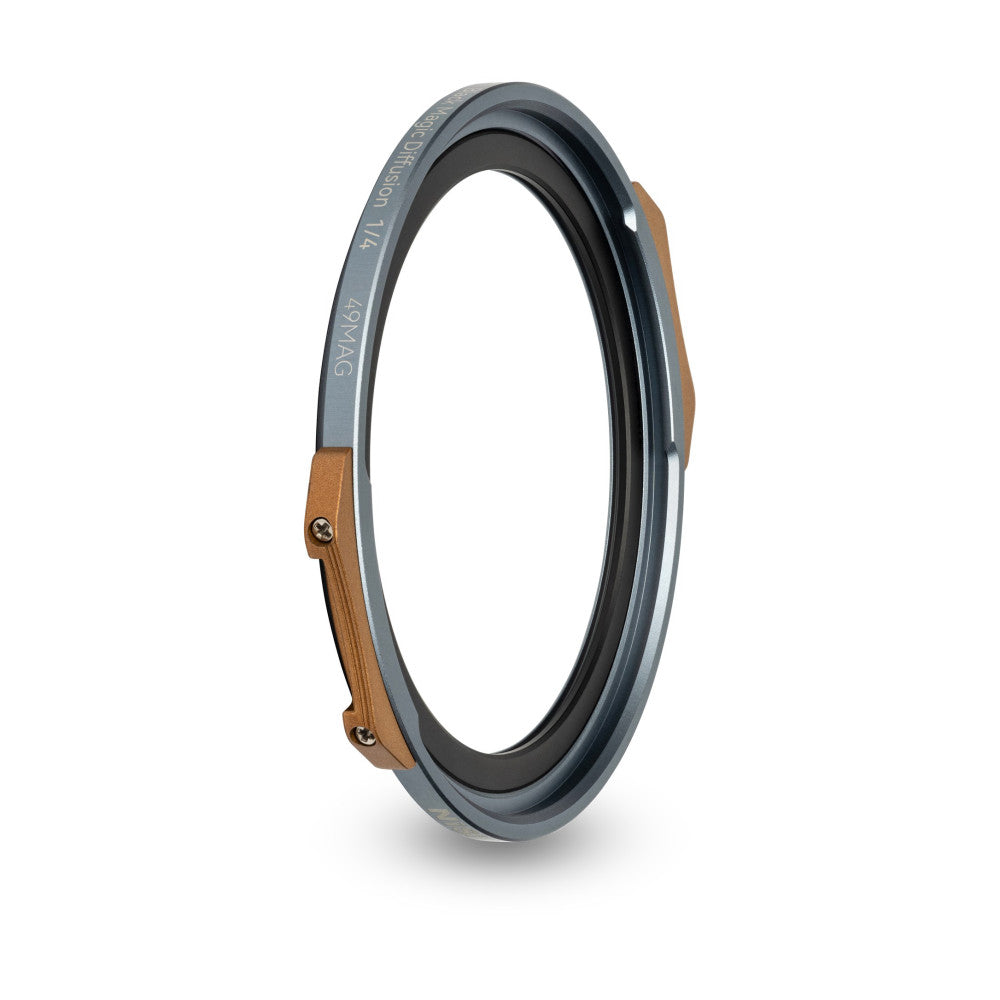 A circular magnetic filter with gray metal ring and brown leather strap attachment, shown at an angle against a white background.