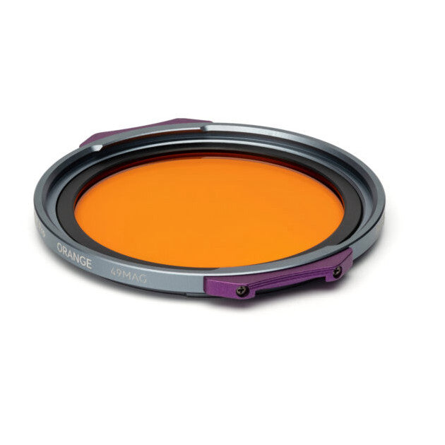 Top-down view of a circular orange magnetic filter with dark gray rim and purple magnetic attachment tabs against a white background.