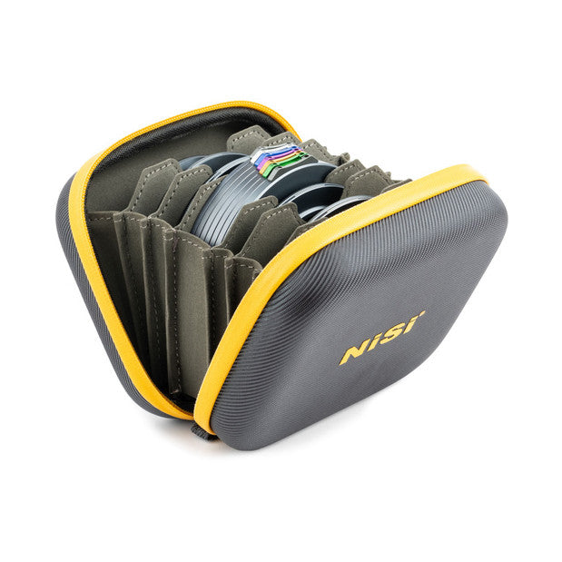 Open NiSi filter storage pouch showing gray interior compartments holding stacked circular filters with colored bands, yellow and gray exterior with yellow zipper pull.