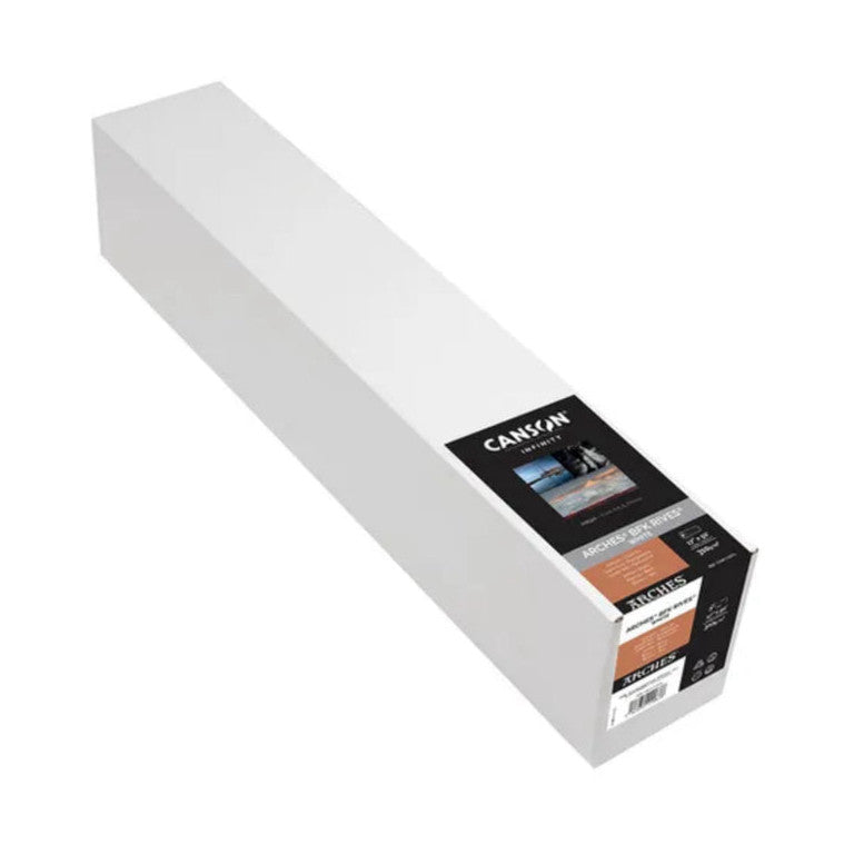 White paper roll with black product label and branding visible on packaging box end, shown at angled perspective against white background.