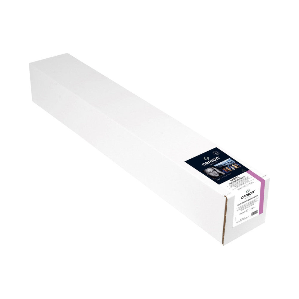 Long white roll of photo paper with branded label and packaging visible at the right end, shown at an angle against white background.