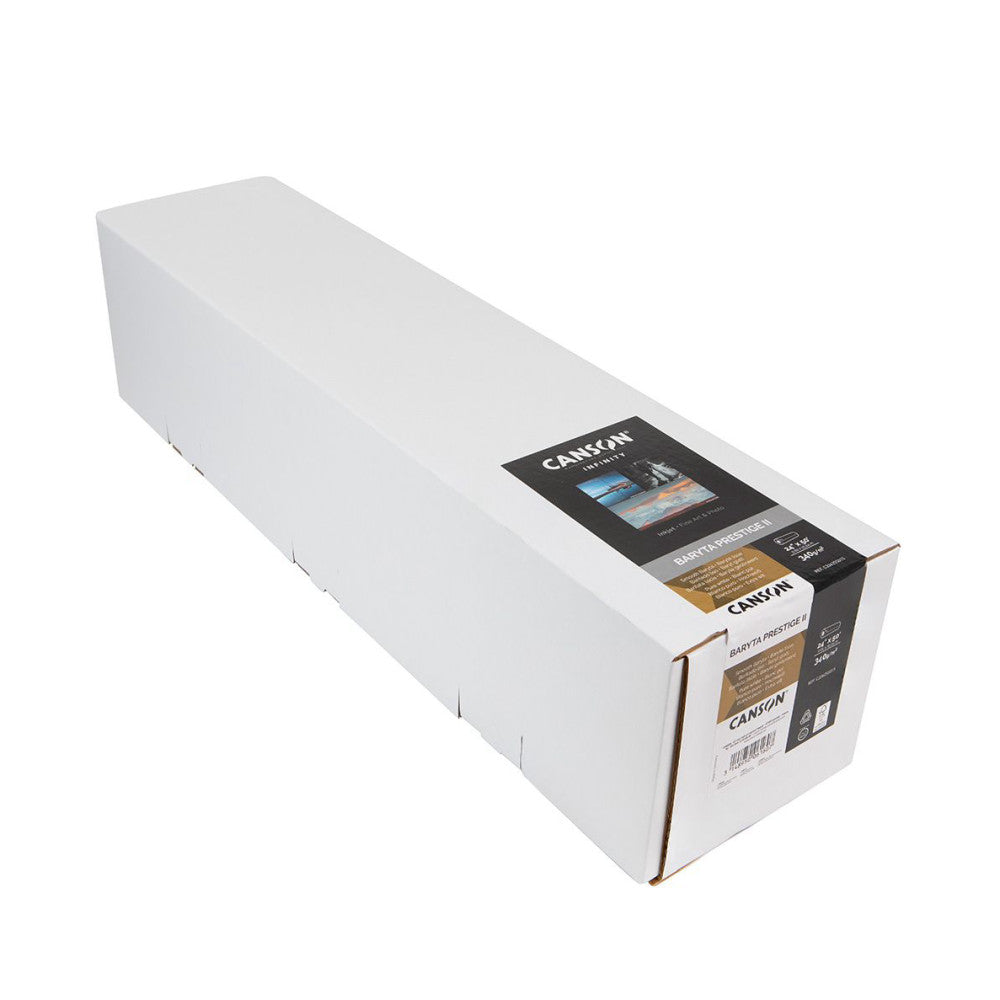White cardboard roll box with black and gold Canson Infinity Baryta Prestige II label, shown at an angle against white background.