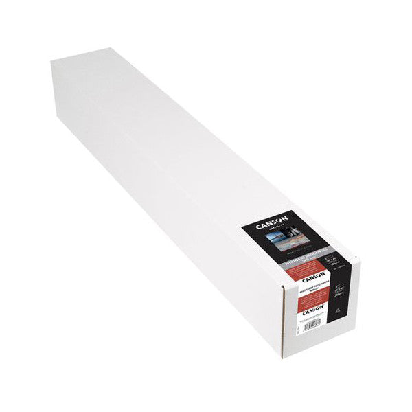 Roll of white canvas paper in cardboard packaging shown at an angled perspective view with product label visible on the end.