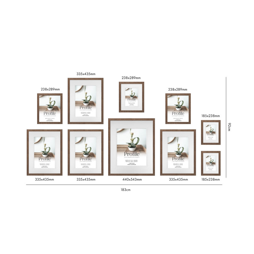 Top-down flat lay view of ten brown wooden picture frames arranged in a gallery wall layout with labeled dimensions, showing frame sizes ranging from 185x238mm to 440x543mm.