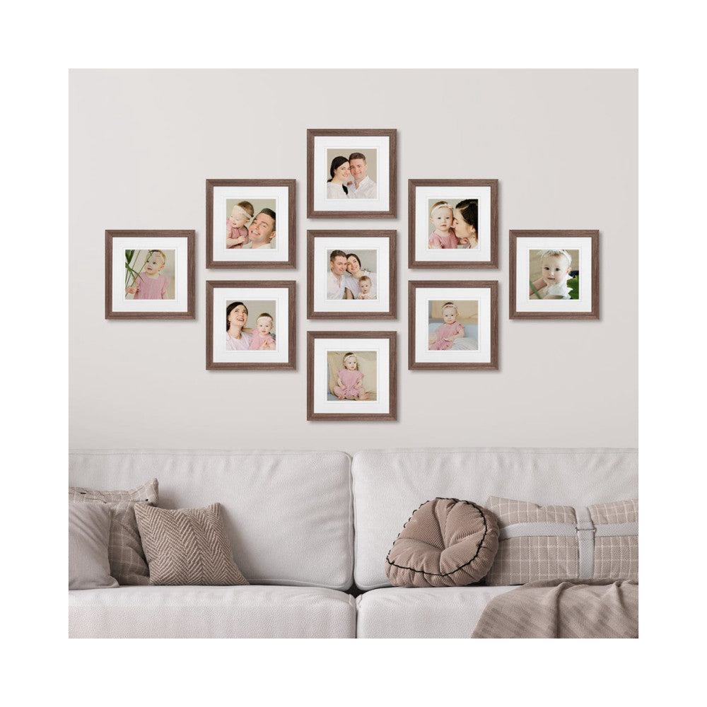 Nine chestnut-framed photos arranged in a diamond pattern on a white wall above a cream-colored sofa, displaying family portraits.