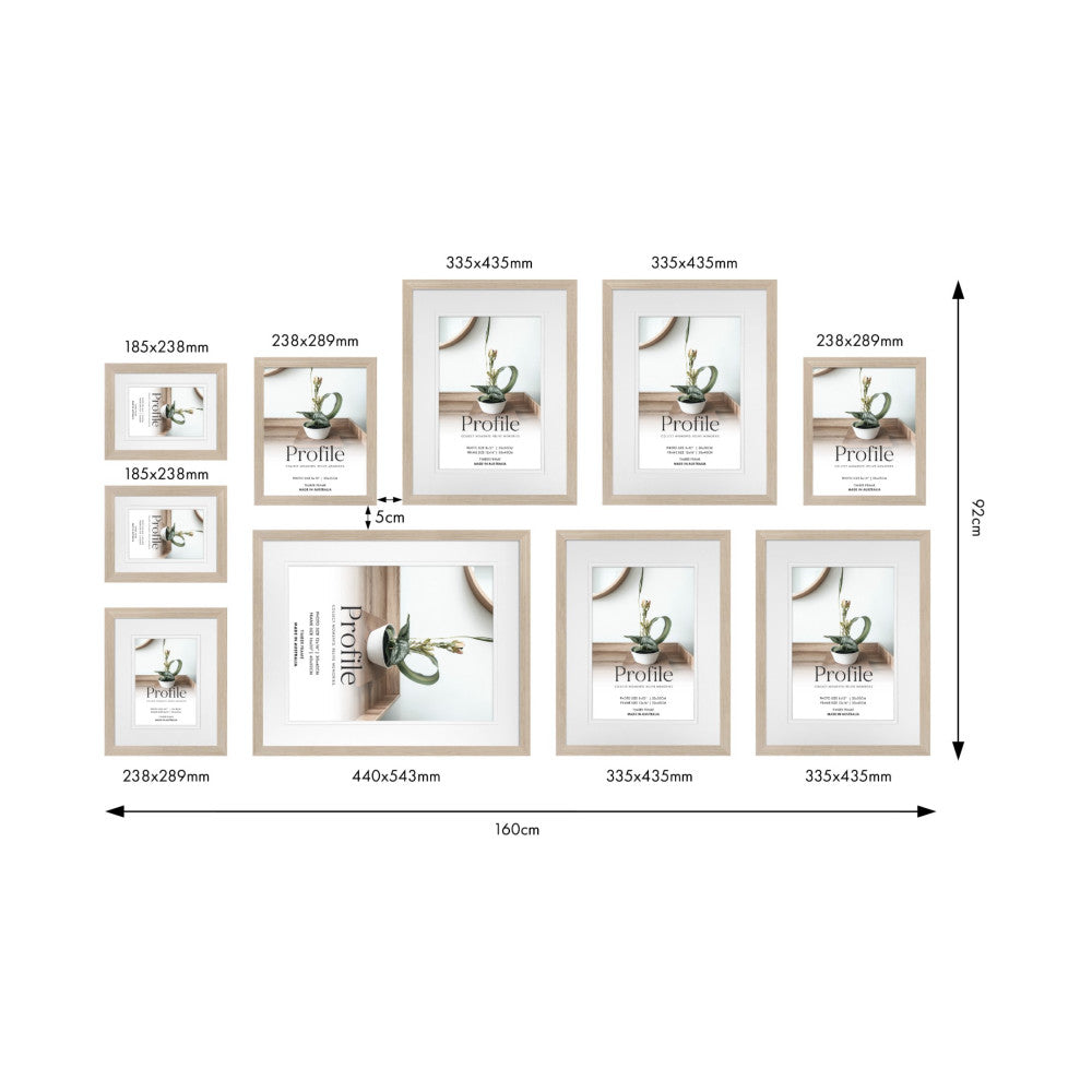 Top-down layout diagram of 10 wooden frames in various sizes arranged on a wall, showing dimensions and spacing measurements.