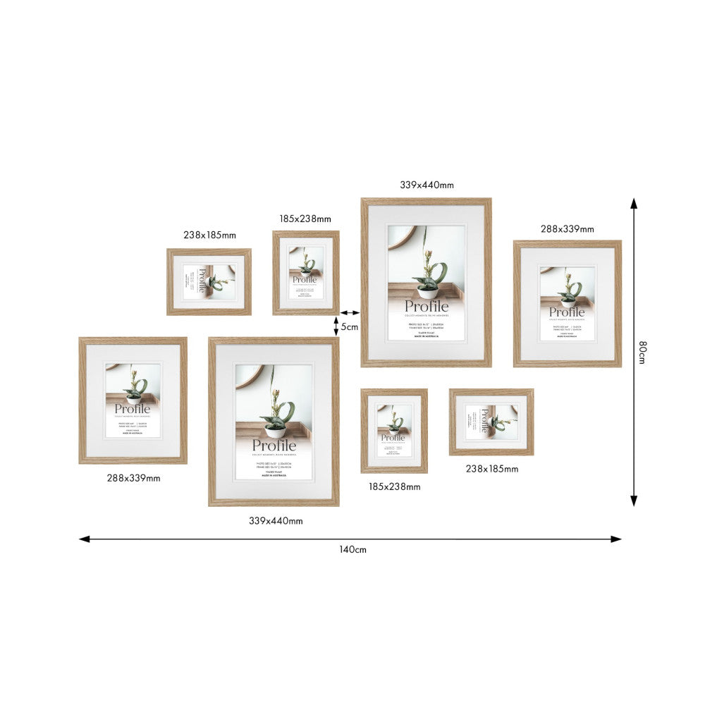 Diagram showing 8 wooden frames in various sizes arranged in a gallery wall layout with dimensions labeled in millimeters and centimeters.