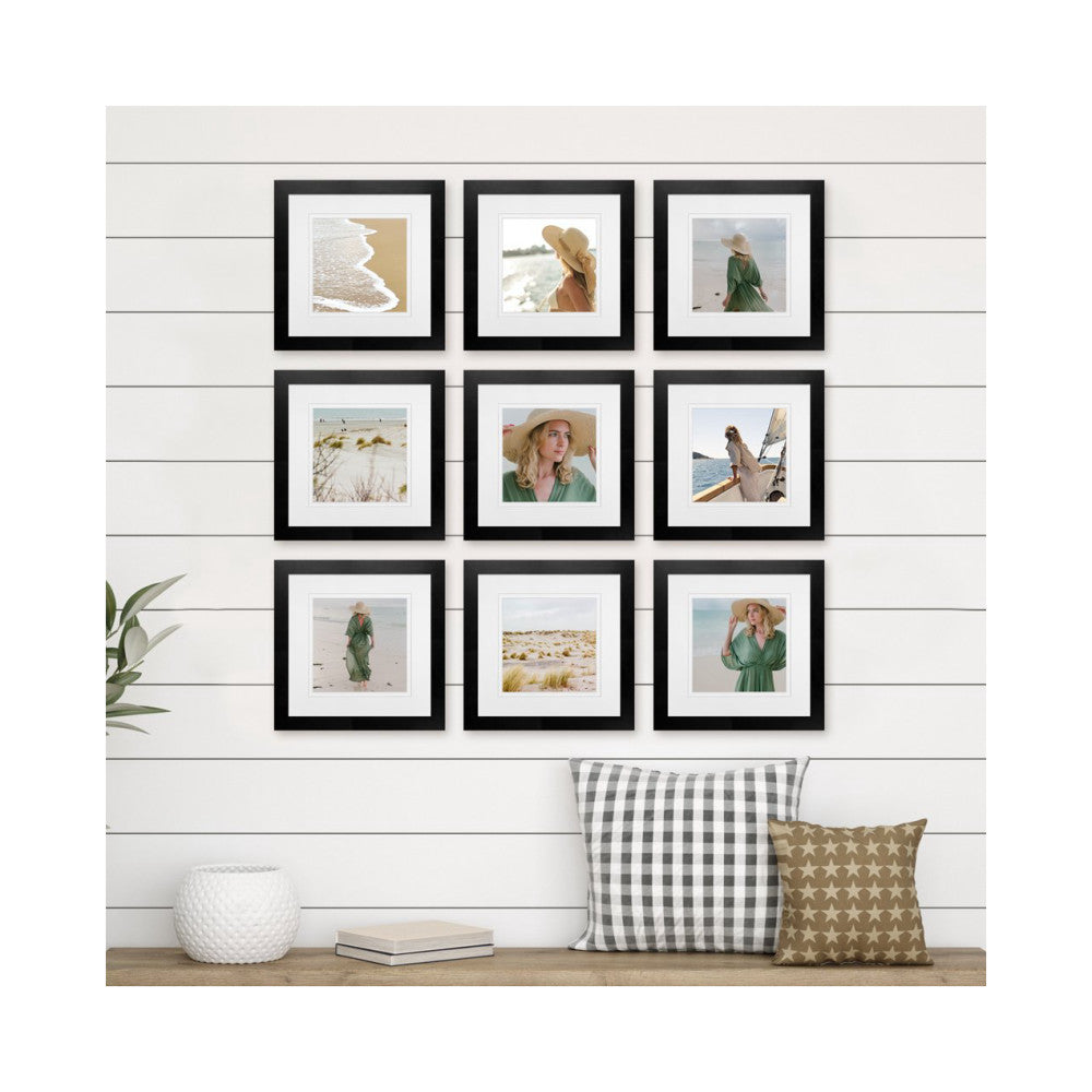 Nine black-framed square photos arranged in a 3x3 grid on shiplap wall above a bench with pillows and decor.