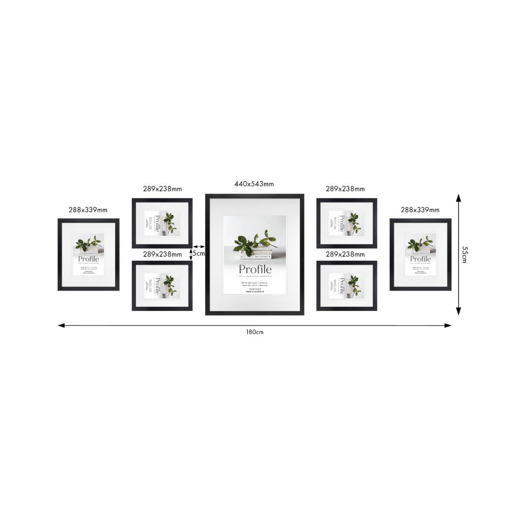 Overhead diagram showing layout and dimensions of seven black frames arranged on a wall, with measurements in millimeters and centimeters.