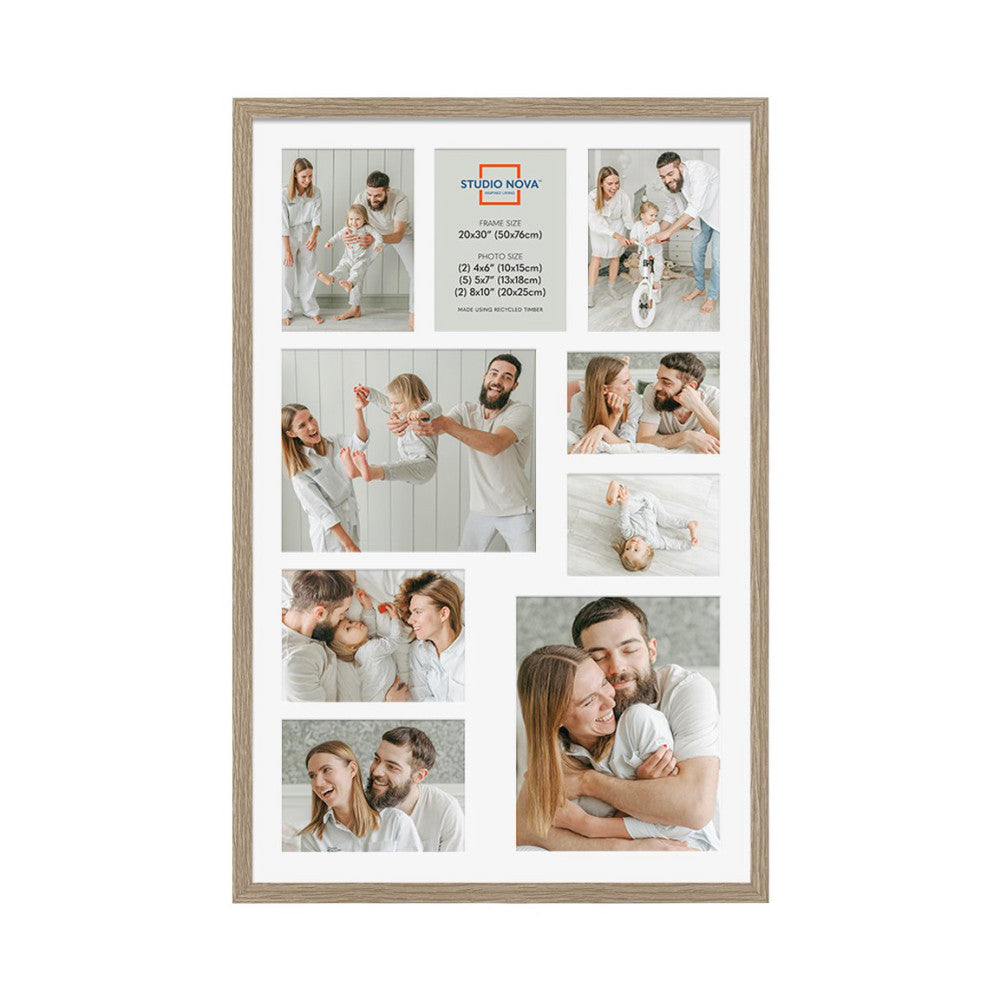 Front view of a wooden frame displaying nine family photos of varying sizes arranged in a grid layout on white matting.