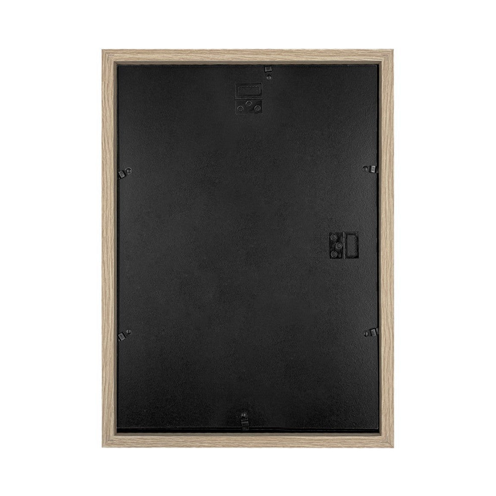 Rear view of a natural wood-framed picture frame showing the black backing panel with metal hanging hardware and corner clips visible.