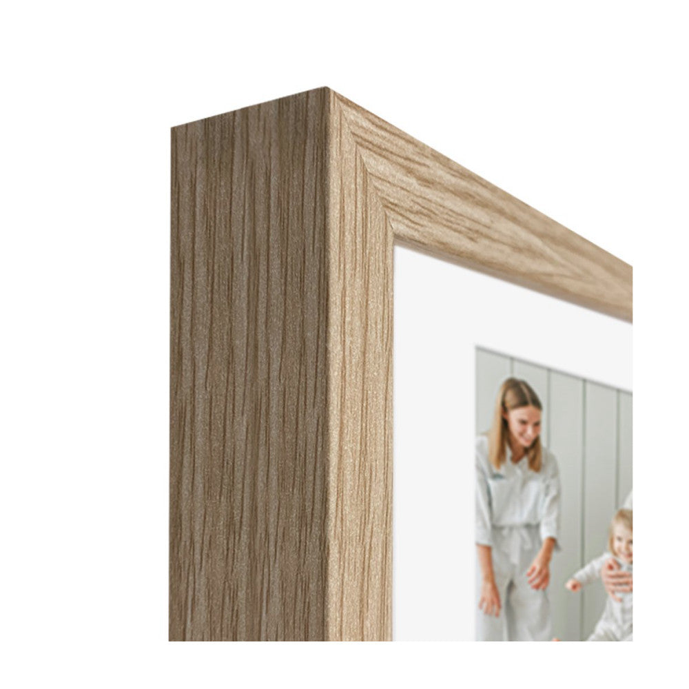 Close-up side angle of a natural wood-grain picture frame with a family photo visible through the opening.