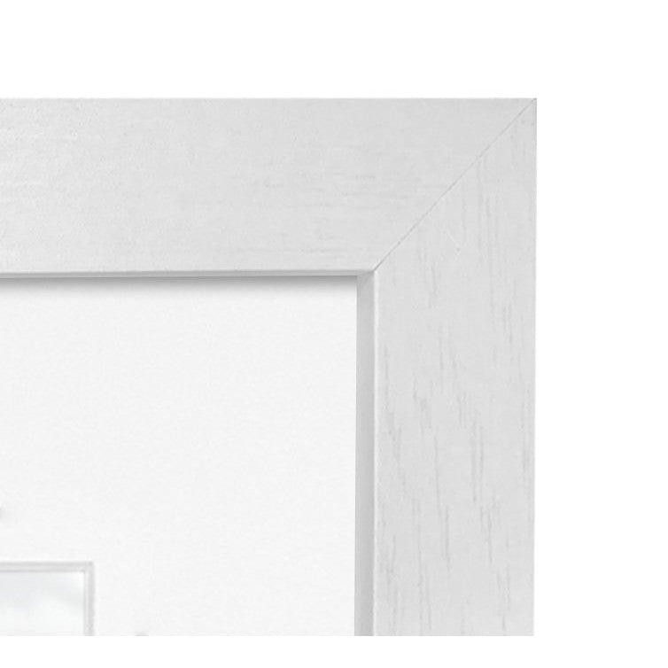 Close-up detail of white wooden frame corner showing beveled edge and wood grain texture