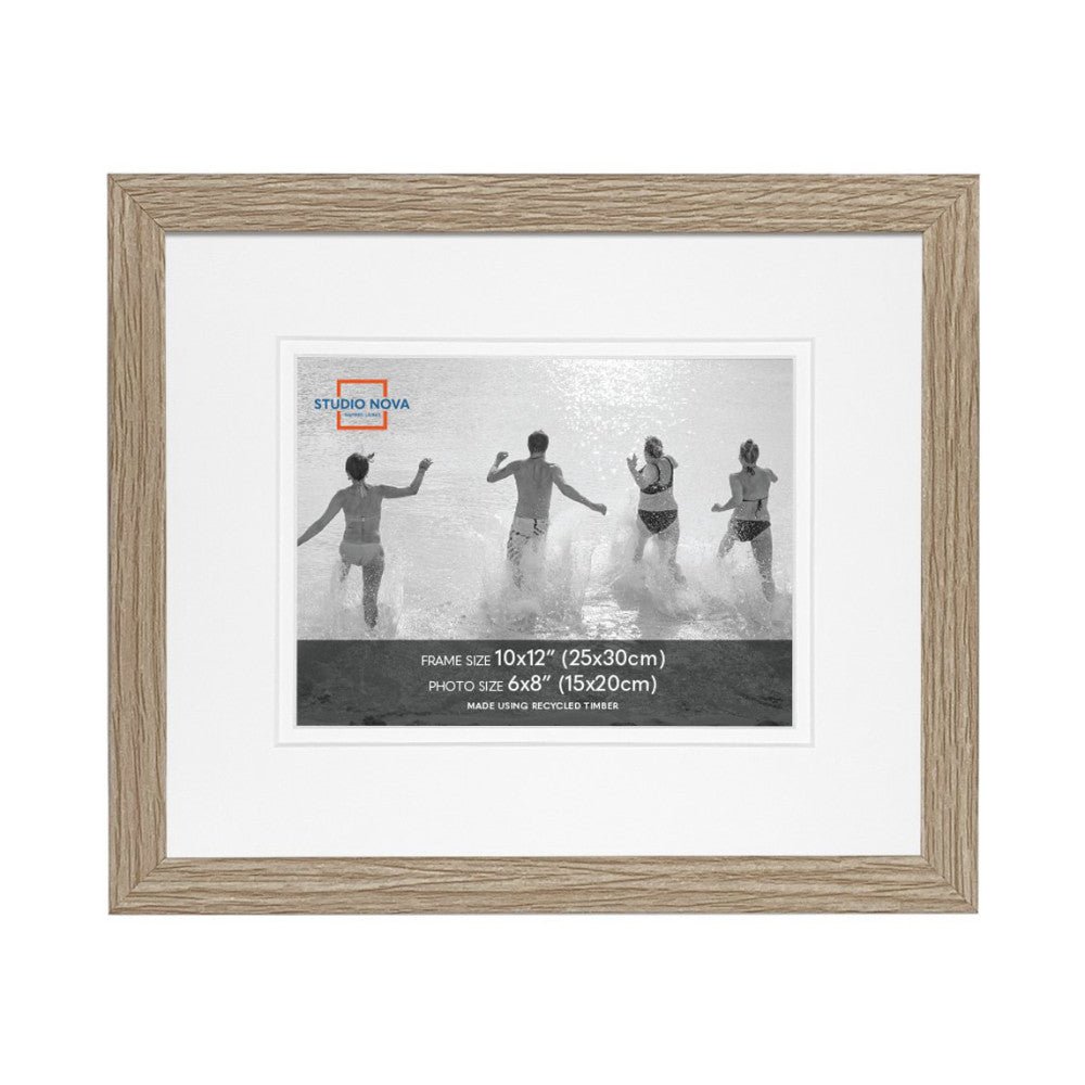 Front view of a single wooden picture frame with white matting displaying a black and white photo of children running into ocean waves.