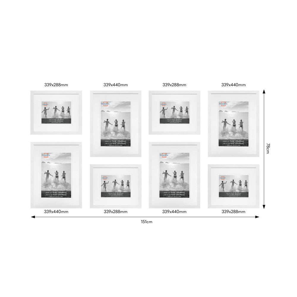 Eight white picture frames in various sizes arranged in a gallery wall layout, displaying black and white beach photographs of children.